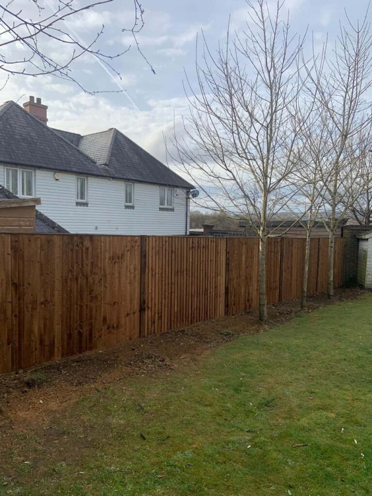 This is a photo of feather edge fencing installed in a residential properties garden by Fast Fix Fencing Wymondham