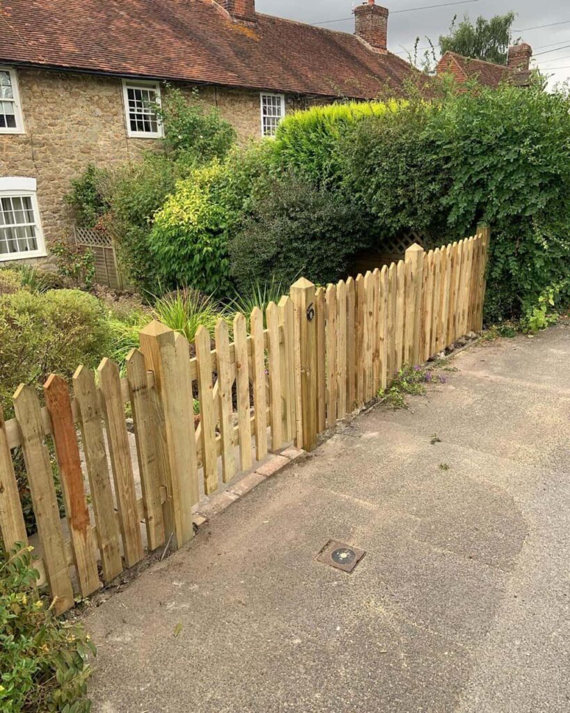 This is a photo of a picket fence and picket gate installed by Fast Fix Fencing Wymondham